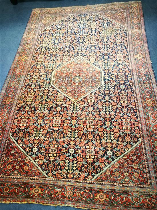 An Isphaphan red and blue ground medallion rug 205 x 132cm